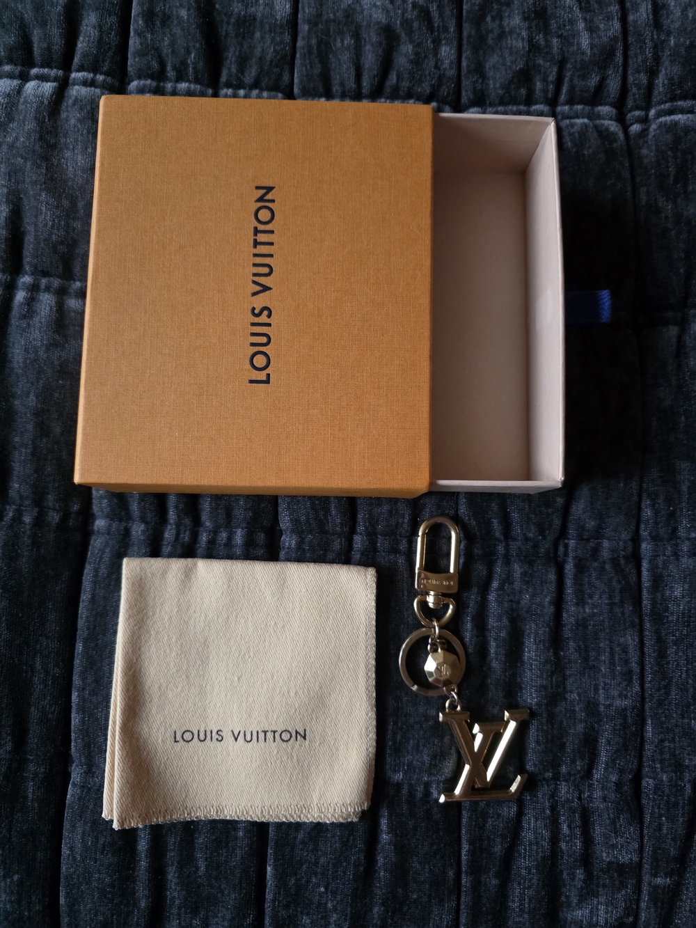 Louis Vuitton Men’s Gold LV Keychain - Designer Accessory